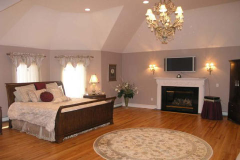 Gracious living in huge master bedroom with a fireplace!